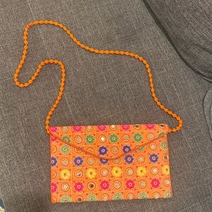 NWOT unique india Orange Floral Patterned Clutch with Strap